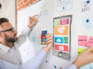 Two fitness business owners discussing, "What is roadmapping?"